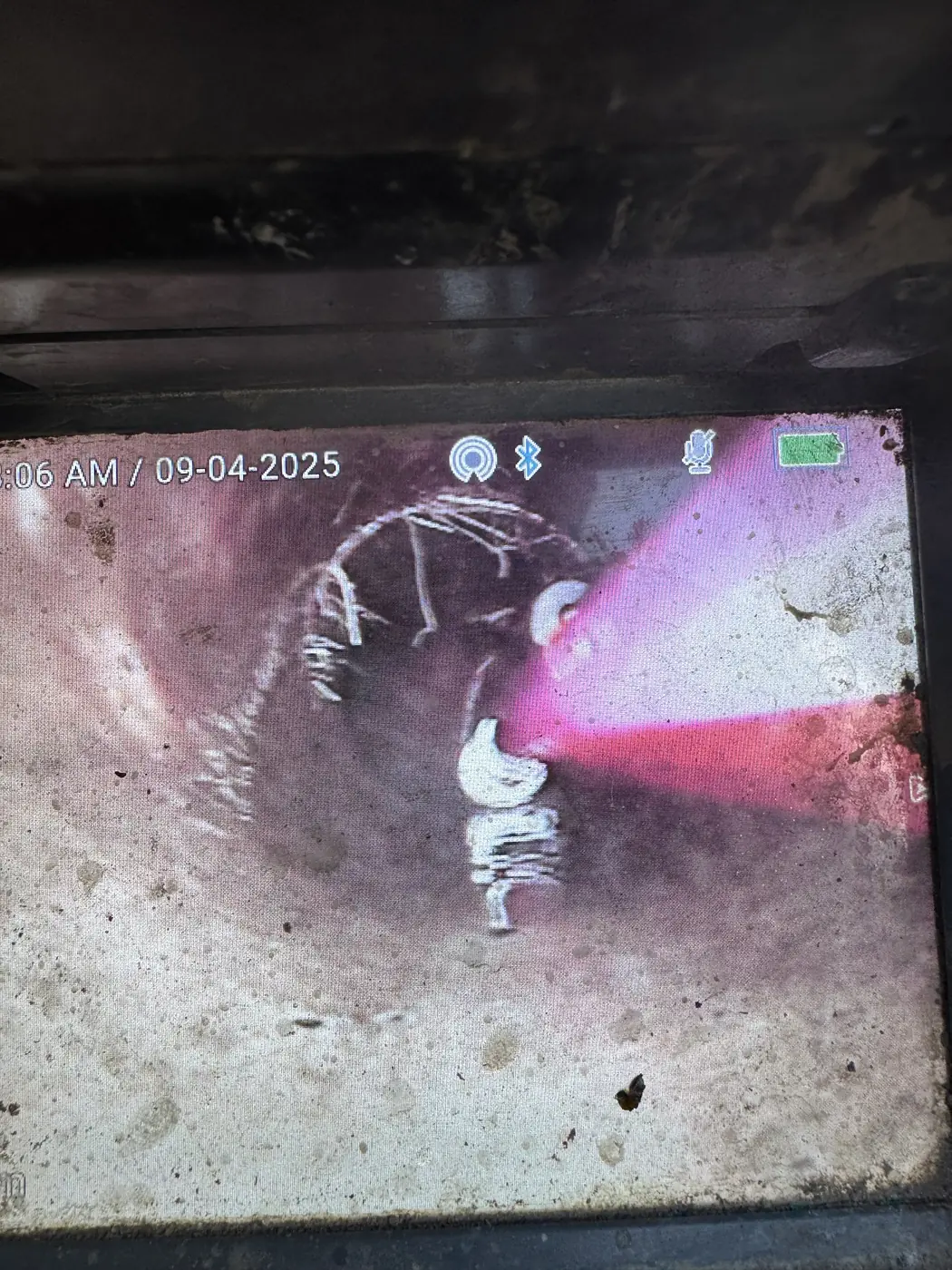 CCTV drain camera screen showing the inside of a sewer pipe
