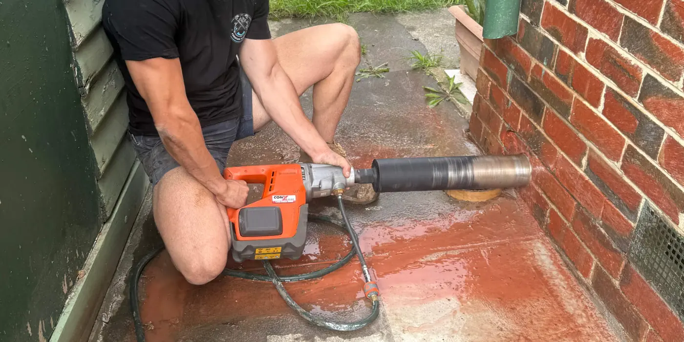 Cutting at a brick wall with a power saw