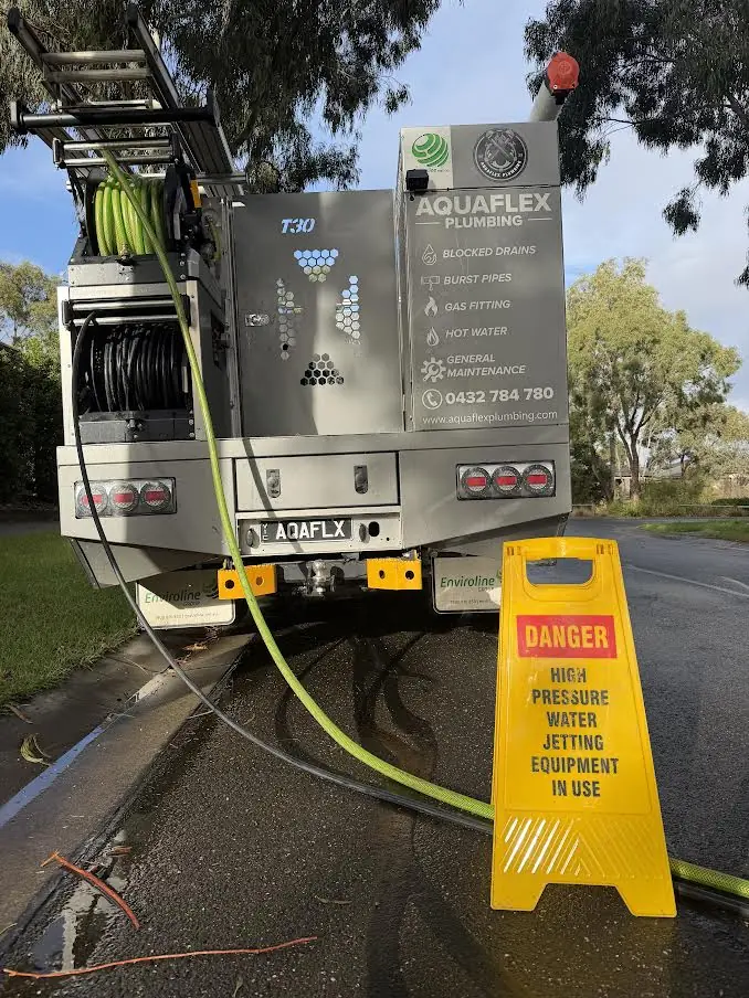Aquaflex high-pressure jetter set up on the ute at a blocked drain job