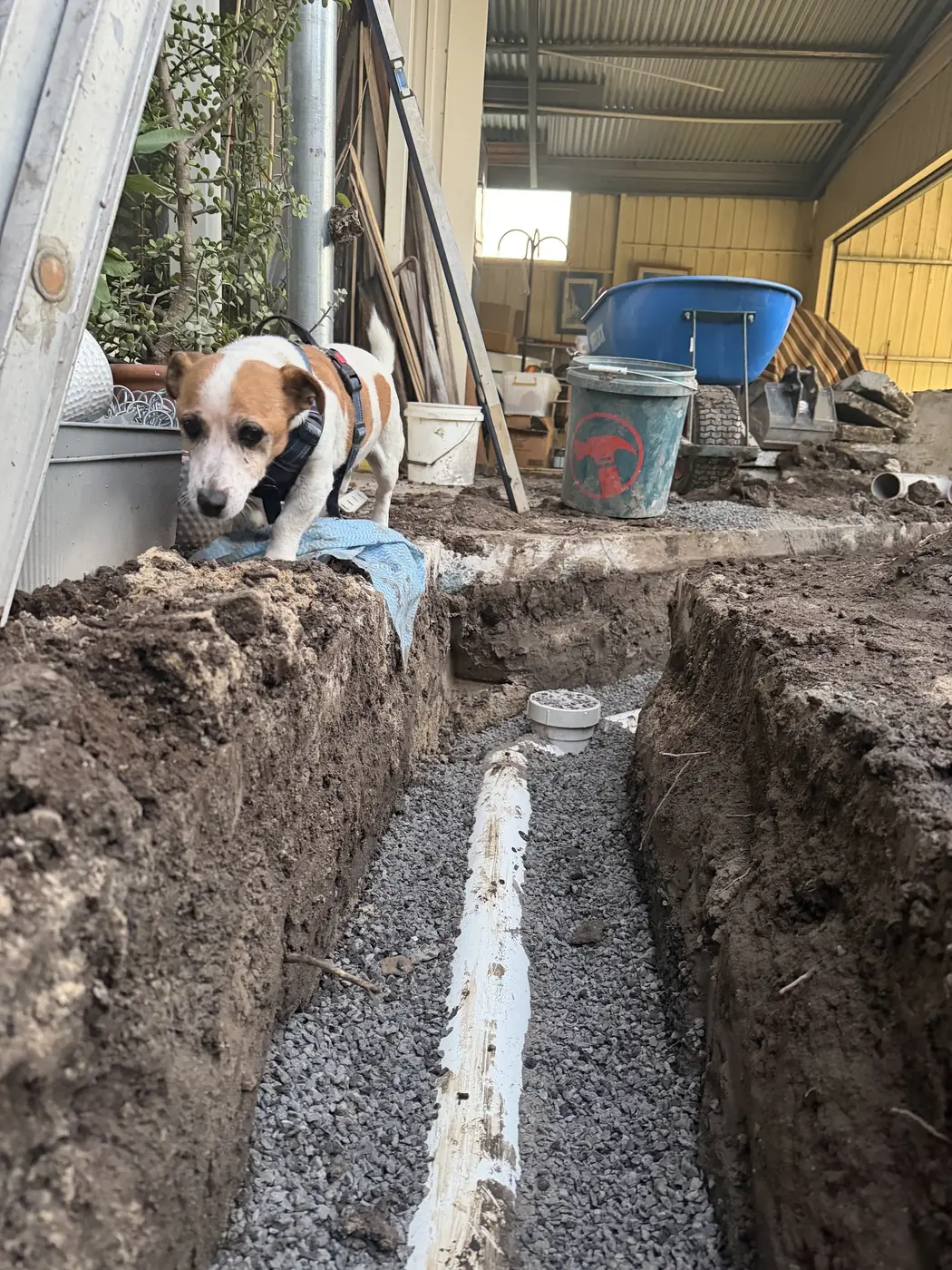New drain pipe laid in a gravel trench