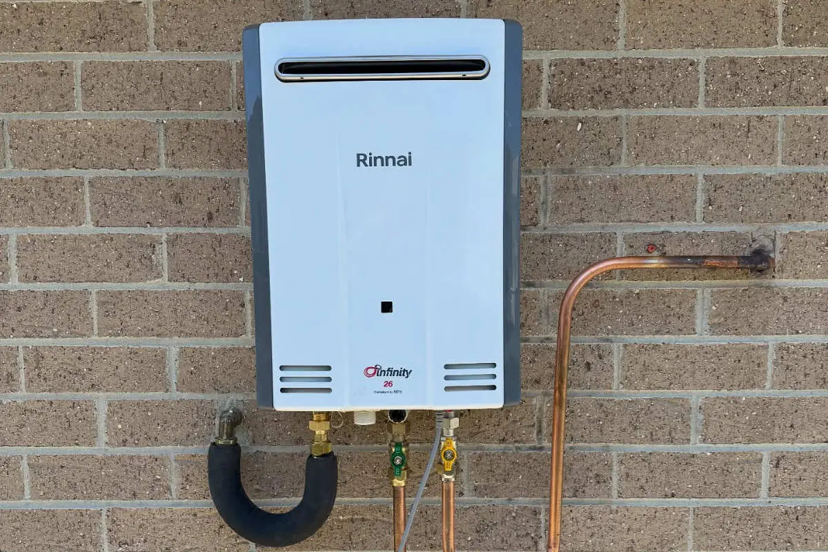 Rinnai continuous-flow gas hot water unit on a brick wall